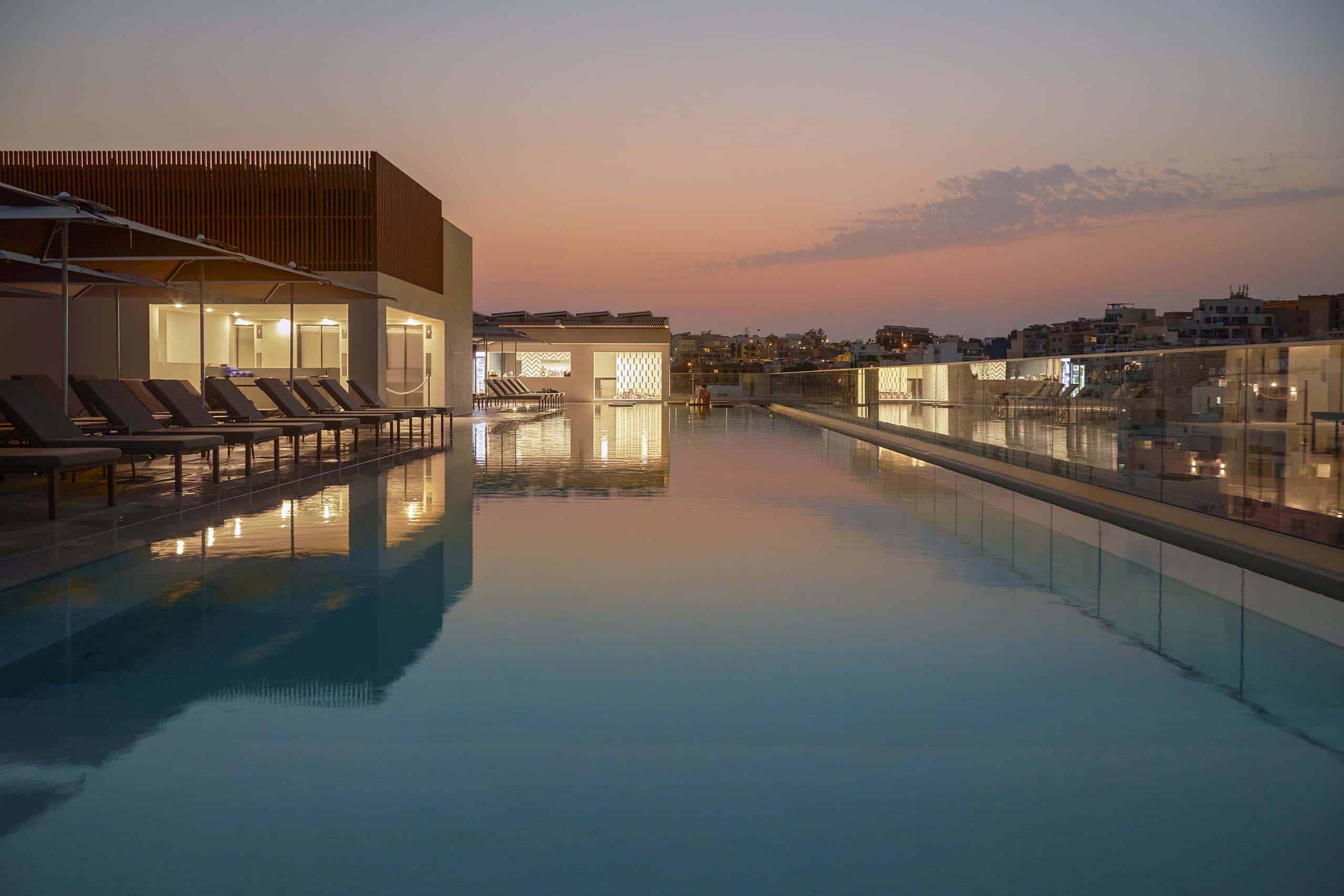 Rooftop infinity pool at Novotel Malta Sliema at sunset