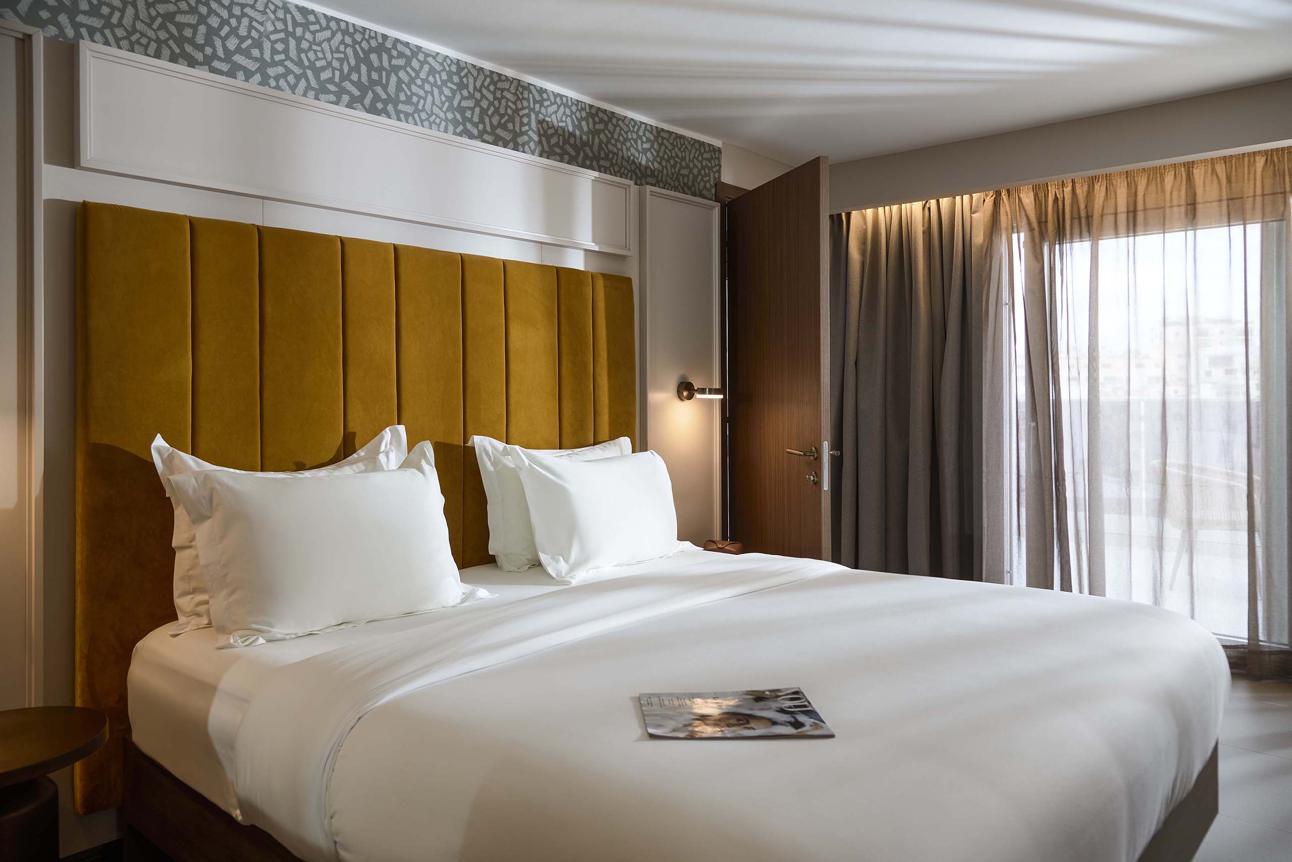 Guest bedroom at Novotel Malta Sliema