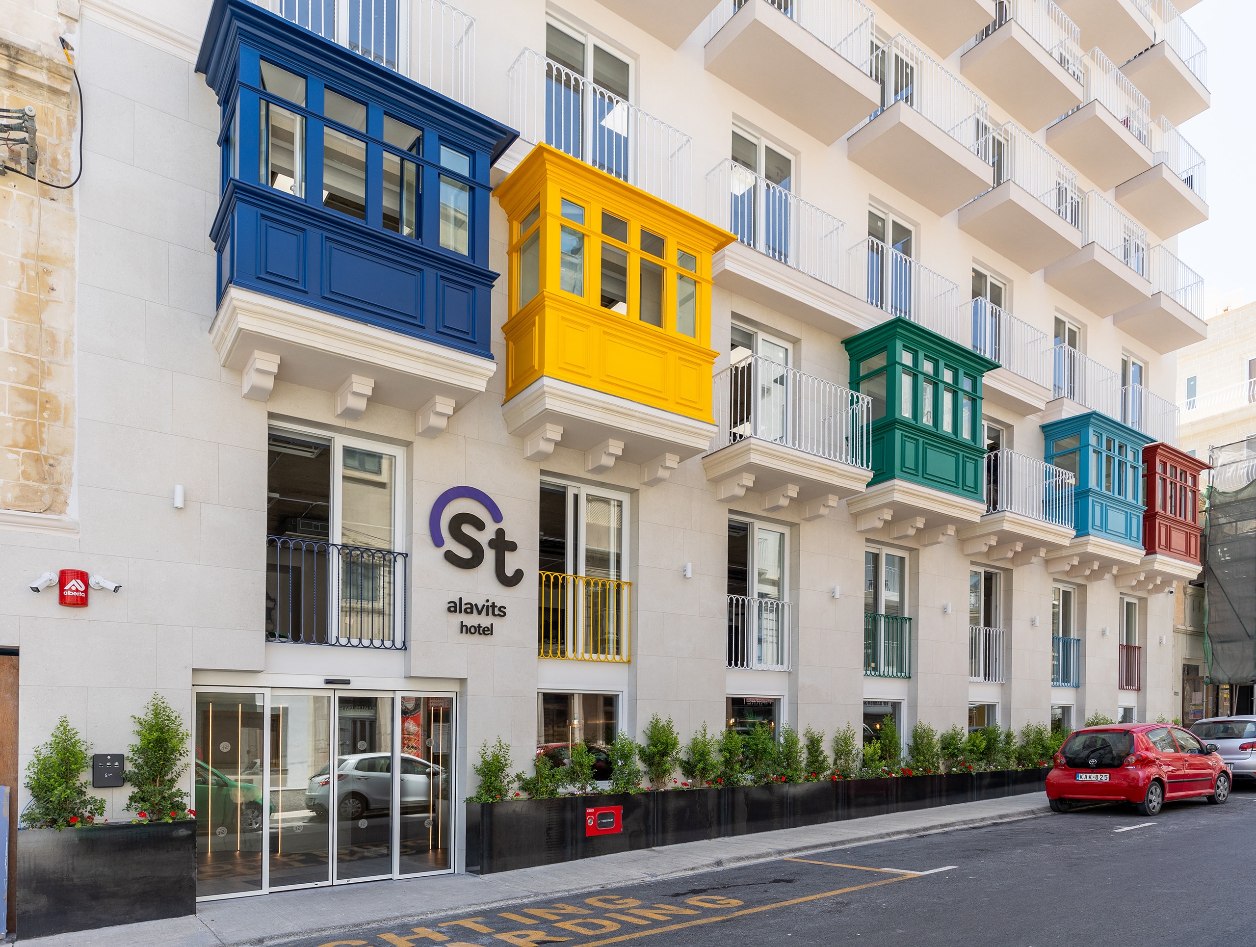 Colourful balconies on modern hotel facade